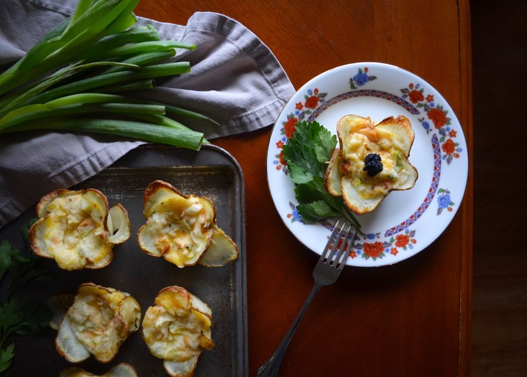 Twice baked potato cups with salmon and caviar